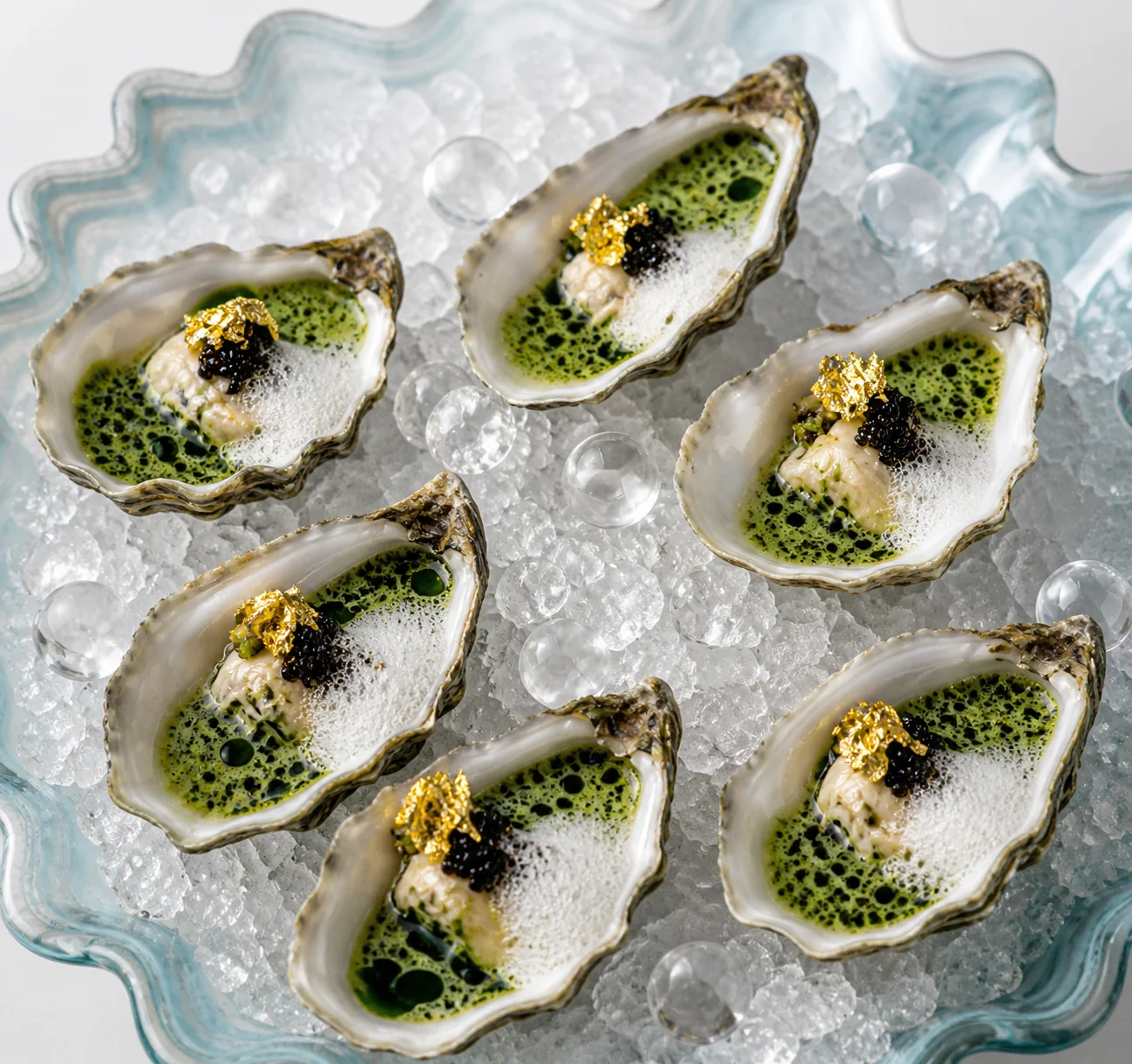 Oysters with gold leaf and caviar
