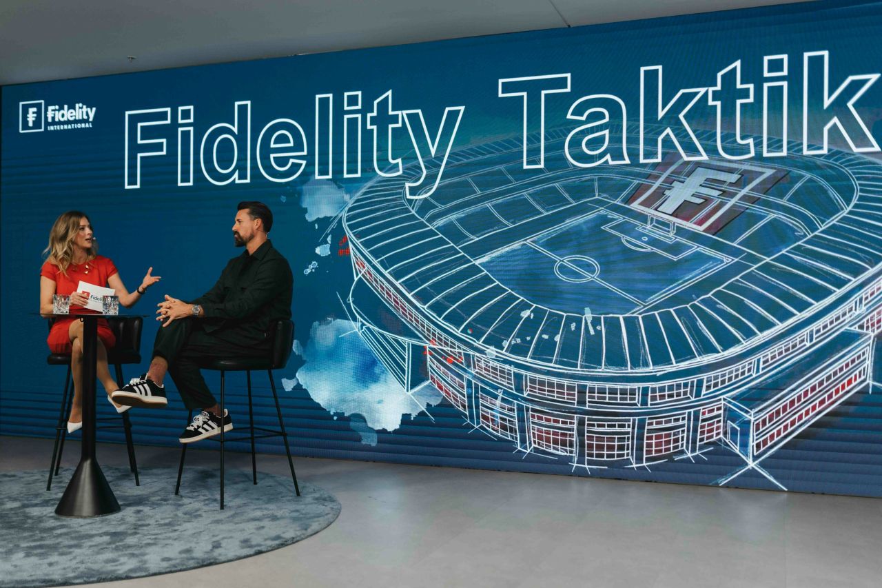 Fireside talk in front of a full-width branded LED wall