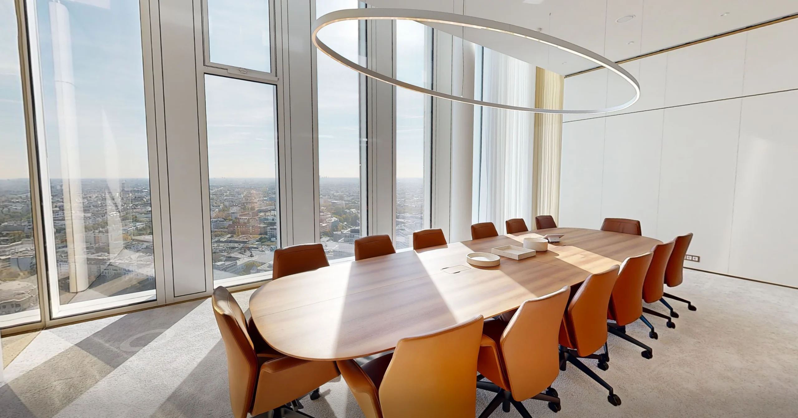 Board meeting room with skyline view
